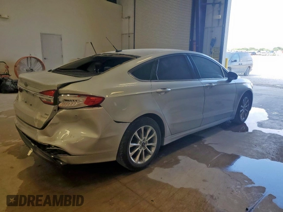 2017 Ford Fusion SE with VIN 3FA6P0HDXHR380057, listed as a Copart auction lot 59583425 with 115,038 mi miles and Salvage title. Bid and sale history available at DreamBid. Image 3.