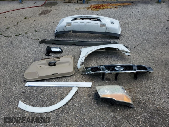 2011 Nissan Armada SV z VIN 5N1BA0ND7BN611338, wystawiony jako Copart lot #57069135 z przebiegiem 183 444 mil mil oraz Szkoda całkowita • Salvage title. Historia ofert i sprzedaży dostępna na DreamBid. Obrazek 13.