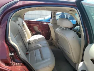 2000 Lincoln Town Car Signature with VIN 1LNHM82W2YY809189, listed as a Copart auction lot 59812665 with 148,236 mi miles and Salvage title. Bid and sale history available at DreamBid. Image 10.