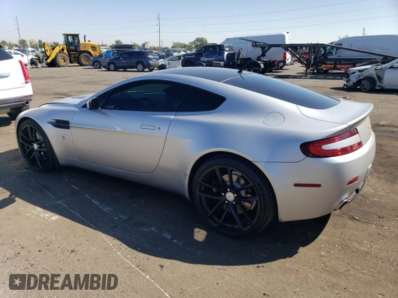 2006 Aston Martin Vantage z VIN SCFBB03B76GC02094, wystawiony jako Copart lot #69683434 z przebiegiem 26 353 mil mil oraz Szkoda całkowita • Salvage title. Historia ofert i sprzedaży dostępna na DreamBid. Obrazek 2.
