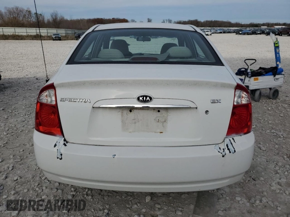 2006 Kia Spectra EX with VIN KNAFE121265208526, listed as a Copart auction lot 80300604 with 101,780 mi miles and Salvage Title. Bid and sale history available at carsss.com. Image 6.