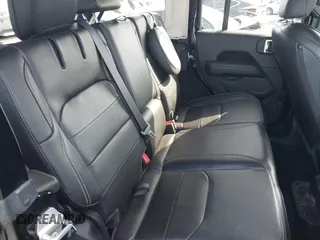 2023 Jeep Wrangler Sahara with VIN 1C4JJXP67PW556933, listed as a IAAI auction lot 41587035 with 20,463 mi miles and . Bid and sale history available at DreamBid. Image 8.
