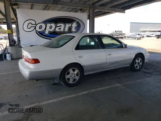 2001 Toyota Camry CE z VIN JT2BG22K010543907, wystawiony jako Copart lot #60874815 z przebiegiem 313 008 mil mil oraz Czysty tytuł • Clean title. Historia ofert i sprzedaży dostępna na DreamBid. Obrazek 3.