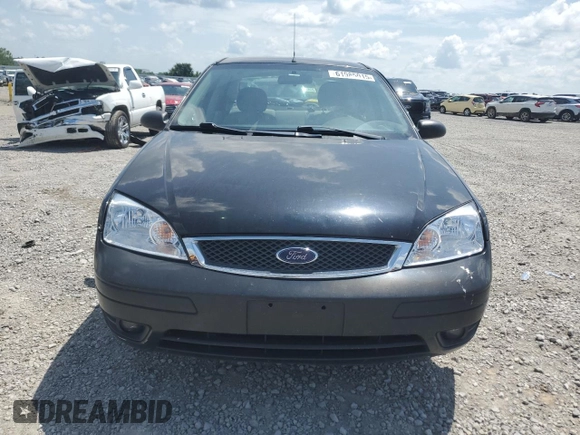 2006 Ford Focus S with VIN 1FAFP34N76W246035, listed as a Copart auction lot 61985015 with 196,498 mi miles and Salvage title. Bid and sale history available at DreamBid. Image 5.