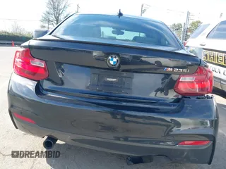2015 BMW 2 Series M235i with VIN WBA1J7C55FV358964, listed as a IAAI auction lot 41674800 with 63,504 mi miles and . Bid and sale history available at carsss.com. Image 16.