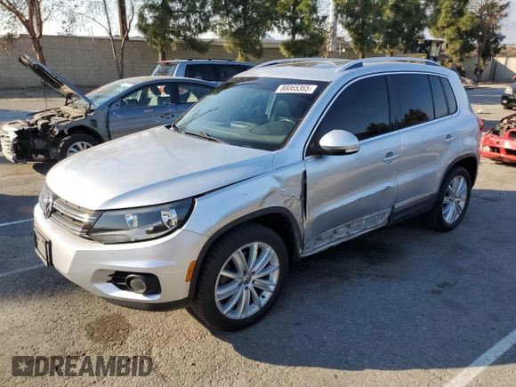 2013 Volkswagen Tiguan S with VIN WVGAV7AX8DW501081, listed as a Copart auction lot 88065365 with 157,312 mi miles and Salvage title. Bid and sale history available at DreamBid. Image 1.