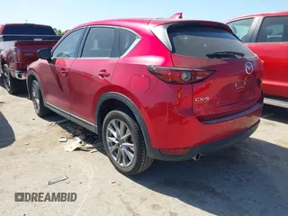 2021 Mazda CX-5 Grand Touring with VIN JM3KFADM4M0476615, listed as a IAAI auction lot 42004814 with 42,483 mi miles. Bid and sale history available at carsss.com. Image 3.