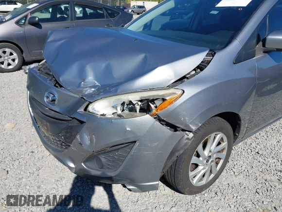 2014 Mazda 5 Sport z VIN JM1CW2BL0E0172678, wystawiony jako IAAI lot #42192057 z przebiegiem 89 848 mil mil oraz . Historia ofert i sprzedaży dostępna na DreamBid. Obrazek 6.