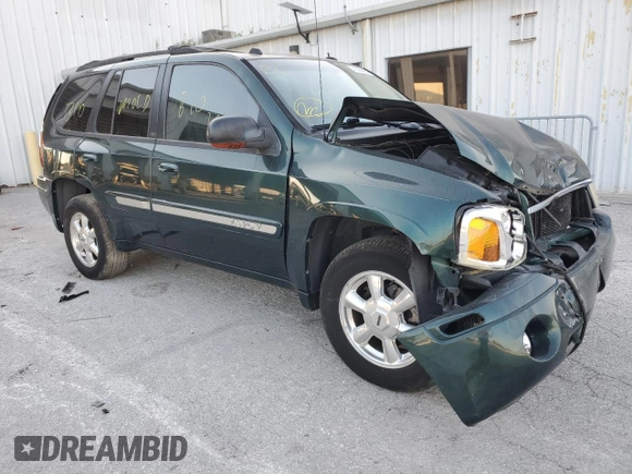 2005 GMC Envoy SLT with VIN 1GKDS13S652329610, listed as a Copart auction lot 76384914 with Not Provided miles and Salvage Title. Bid and sale history available at DreamBid. Image 4.