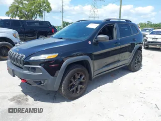 2017 Jeep Cherokee Trailhawk with VIN 1C4PJMBS9HW537962, listed as a IAAI auction lot 42002460 with 129,037 mi miles and . Bid and sale history available at DreamBid. Image 18.