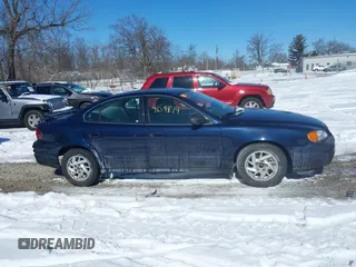2004 Pontiac Grand Am SE with VIN 1G2NE52F24M692805, listed as a IAAI auction lot 41591014 with 137,072 mi miles. Bid and sale history available at carsss.com. Image 13.