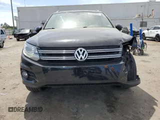 2013 Volkswagen Tiguan SE z VIN WVGAV7AX4DW523112, wystawiony jako Copart lot #53261855 z przebiegiem 86 190 mil mil oraz Szkoda całkowita • Salvage title. Historia ofert i sprzedaży dostępna na DreamBid. Obrazek 5.