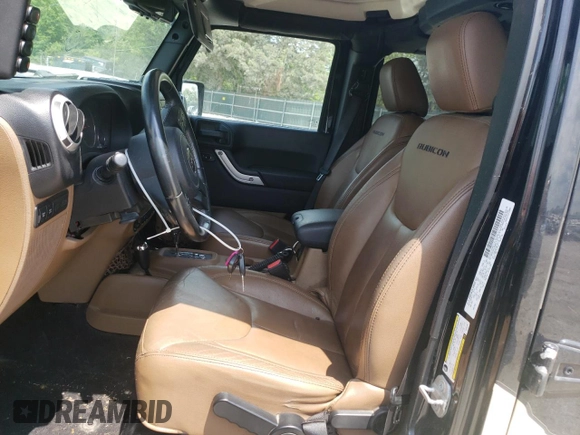 2014 Jeep Wrangler Unlimited Rubicon with VIN 1C4BJWFGXEL291187, listed as a Copart auction lot 54897675 with 227,478 mi miles and Salvage title. Bid and sale history available at DreamBid. Image 7.