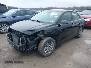 2023 Kia Rio S with VIN 3KPA24AD6PE594280, listed as a IAAI auction lot 41986833 with 7,688 mi miles. Bid and sale history available at carsss.com. Image 2.