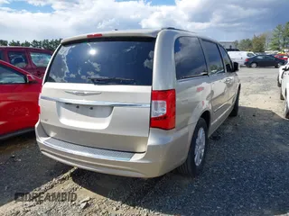 2013 Chrysler Town & Country Touring with VIN 2C4RC1BG8DR559824, listed as a IAAI auction lot 41818237 with 211,248 mi miles. Bid and sale history available at carsss.com. Image 4.