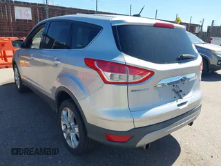 2013 Ford Escape SEL with VIN 1FMCU9HX0DUD42081, listed as a IAAI auction lot 42293456 with 100,013 mi miles and . Bid and sale history available at DreamBid. Image 3.