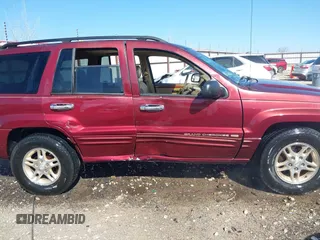 1999 Jeep Grand Cherokee Limited with VIN 1J4GW68N3XC770468, listed as a IAAI auction lot 41793600 with 65,277 mi miles. Bid and sale history available at carsss.com. Image 13.