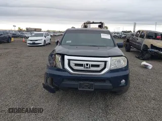 2011 Honda Pilot EX with VIN 5FNYF4H41BB004997, listed as a IAAI auction lot 40505560 with 141,487 mi miles. Bid and sale history available at carsss.com. Image 12.