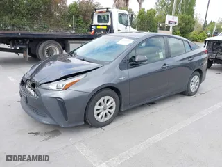 2019 Toyota Prius L Eco with VIN JTDKARFU9K3075219, listed as a IAAI auction lot 42113323 with 218,986 mi miles. Bid and sale history available at carsss.com. Image 2.