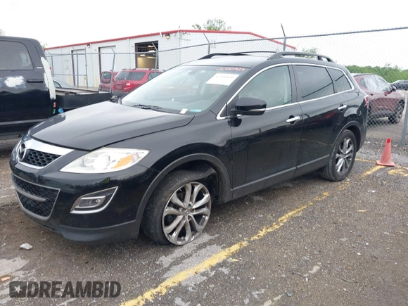 2012 Mazda CX-9 Grand Touring z VIN JM3TB2DAXC0338667, wystawiony jako IAAI lot #42260820 z przebiegiem 138 111 mil mil oraz . Historia ofert i sprzedaży dostępna na DreamBid. Obrazek 2.