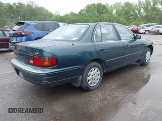 1996 Toyota Camry DX with VIN JT2BG12K5T0346311, listed as a IAAI auction lot 42130482 with 214,872 mi miles. Bid and sale history available at carsss.com. Image 4.