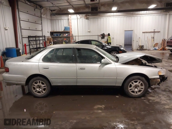 1995 Toyota Camry LE with VIN 4T1GK12E5SU080734, listed as a IAAI auction lot 41738102 with 211,559 mi miles. Bid and sale history available at carsss.com. Image 14.