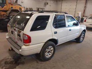 2004 Isuzu Rodeo S with VIN 4S2CK58W244313115, listed as a IAAI auction lot 42147475 with 186,594 mi miles and . Bid and sale history available at DreamBid. Image 4.