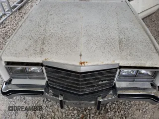 1983 Cadillac Eldorado z VIN 1G6AL5787DE628931, wystawiony jako Copart lot #73113774 z przebiegiem 28 559 mil mil oraz Tytuł czysty. Historia ofert i sprzedaży dostępna na DreamBid. Obrazek 11.