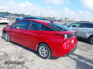 2021 Toyota Prius L Eco with VIN JTDKAMFU4M3145215, listed as a IAAI auction lot 41926274 with 74,220 mi miles. Bid and sale history available at carsss.com. Image 3.