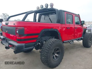 2020 Jeep Gladiator Rubicon with VIN 1C6JJTBG4LL178260, listed as a IAAI auction lot 42602460 with 61,899 mi miles and . Bid and sale history available at DreamBid. Image 4.