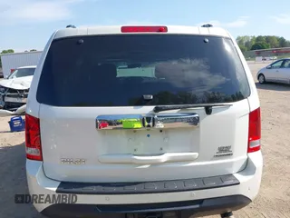 2013 Honda Pilot Touring with VIN 5FNYF3H92DB034731, listed as a IAAI auction lot 42049853 with 127,278 mi miles and . Bid and sale history available at DreamBid. Image 16.