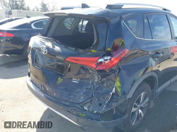 2016 Toyota RAV4 XLE with VIN 2T3RFREV6GW459313, listed as a IAAI auction lot 42074337 with 149,914 mi miles and . Bid and sale history available at DreamBid. Image 6.