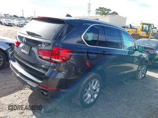 2014 BMW X5 sDrive35i with VIN 5UXKR2C56E0H32059, listed as a IAAI auction lot 41096908 with 124,322 mi miles. Bid and sale history available at carsss.com. Image 4.