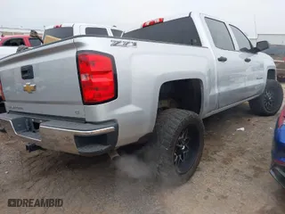 2014 Chevrolet Silverado 1500 LT with VIN 3GCUKREC6EG432954, listed as a IAAI auction lot 41491764 with 148,293 mi miles. Bid and sale history available at carsss.com. Image 4.