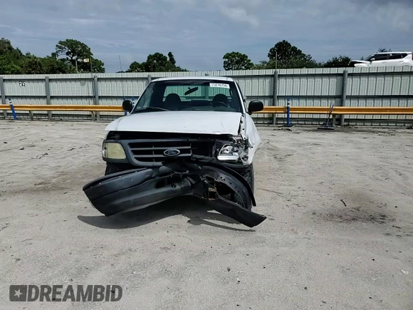 2002 Ford F-150 XL with VIN 1FTRF17W32NB86385, listed as a Copart auction lot 73276754 with 100,817 mi miles and Salvage Title. Bid and sale history available at carsss.com. Image 11.
