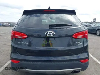 2014 Hyundai Santa Fe z VIN 5XYZUDLBXEG162476, wystawiony jako IAAI lot #41910671 z przebiegiem 146 607 mil mil oraz . Historia ofert i sprzedaży dostępna na DreamBid. Obrazek 16.