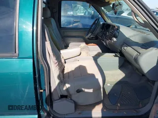 1996 GMC Suburban with VIN 1GDEC16R5TJ742543, listed as a IAAI auction lot 41910103 with 159,469 mi miles and . Bid and sale history available at DreamBid. Image 5.
