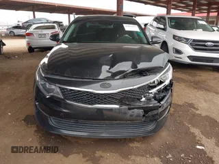 2016 Kia Optima LX with VIN KNAGT4L32G5111503, listed as a IAAI auction lot 42011975 with 114,476 mi miles. Bid and sale history available at carsss.com. Image 12.