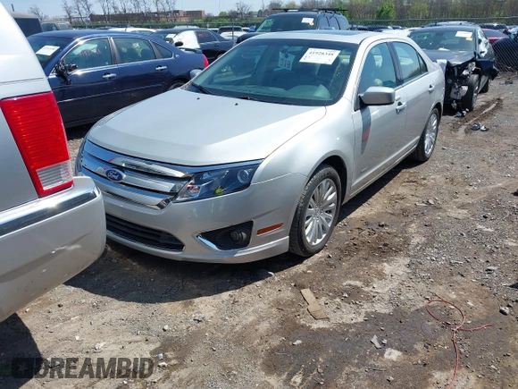 2010 Ford Fusion Hybrid z VIN 3FADP0L38AR411074, wystawiony jako IAAI lot #41928348 z przebiegiem 79 306 mil mil oraz . Historia ofert i sprzedaży dostępna na DreamBid. Obrazek 6.