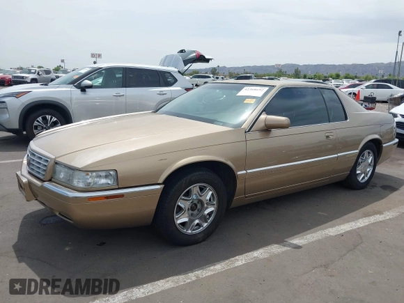 1999 Cadillac Eldorado ESC z VIN 1G6EL12Y5XU603764, wystawiony jako IAAI lot #42368692 z przebiegiem 154 613 mil mil oraz . Historia ofert i sprzedaży dostępna na DreamBid. Obrazek 2.