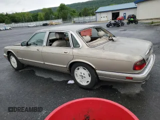 1995 Jaguar XJ with VIN SAJHX174XSC738856, listed as a Copart auction lot 57768915 with Not provided miles and Salvage title. Bid and sale history available at DreamBid. Image 2.