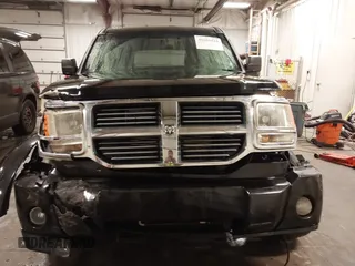 2007 Dodge Nitro SXT with VIN 1D8GU28K67W663621, listed as a IAAI auction lot 41691529 with 211,556 mi miles. Bid and sale history available at carsss.com. Image 13.