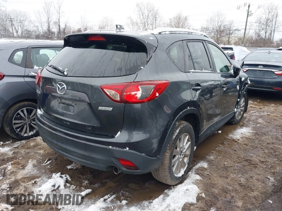 2014 Mazda CX-5 Touring with VIN JM3KE2CY2E0407453, listed as a IAAI auction lot 41564916 with 104,852 mi miles. Bid and sale history available at carsss.com. Image 4.