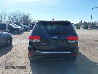 2014 Jeep Grand Cherokee Overland with VIN 1C4RJECG4EC523747, listed as a IAAI auction lot 40802143 with 124,079 mi miles. Bid and sale history available at carsss.com. Image 16.