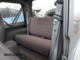 2002 Jeep Wrangler Sport with VIN 1J4FA49S02P705470, listed as a IAAI auction lot 42477770 with 59,395 mi miles and . Bid and sale history available at DreamBid. Image 8.