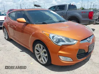 2013 Hyundai Veloster w/Black Int with VIN KMHTC6AD0DU147017, listed as a IAAI auction lot 42707858 with 115,130 mi miles and . Bid and sale history available at DreamBid. Image 1.