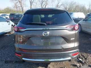 2016 Mazda CX-9 Grand Touring z VIN JM3TCBDY3G0104001, wystawiony jako IAAI lot #41961054 z przebiegiem 77 057 mil mil oraz . Historia ofert i sprzedaży dostępna na DreamBid. Obrazek 16.
