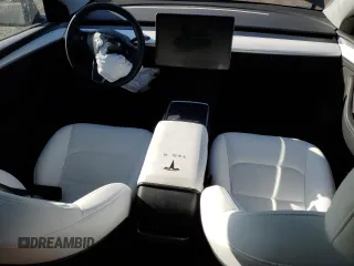 2023 Tesla Model Y Long Range z VIN 7SAYGDEE0PA206005, wystawiony jako Copart lot #50681145 z przebiegiem 31 989 mil mil oraz Szkoda całkowita • Salvage title. Historia ofert i sprzedaży dostępna na DreamBid. Obrazek 8.