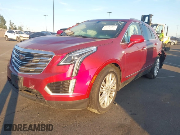 2019 Cadillac XT5 Premium Luxury FWD with VIN 1GYKNERS4KZ174349, listed as a IAAI auction lot 41614364 with 104,979 mi miles and . Bid and sale history available at DreamBid. Image 2.
