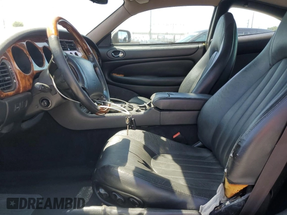 1997 Jaguar XK with VIN SAJGX5740VC014035, listed as a Copart auction lot 53066215 with 140,692 mi miles and Salvage Title. Bid and sale history available at DreamBid. Image 7.